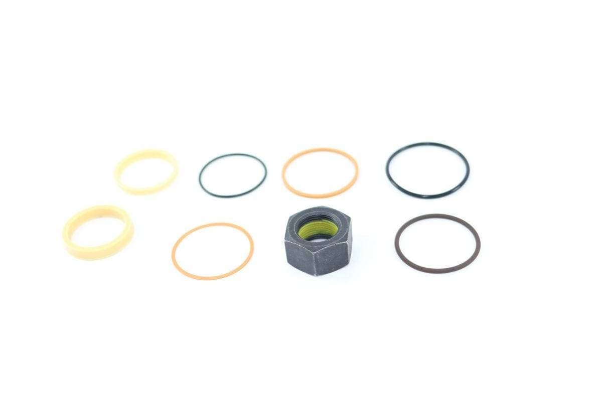 Genuine Bobcat Seal Kit 7137869 showing all seals and nut included in the kit.