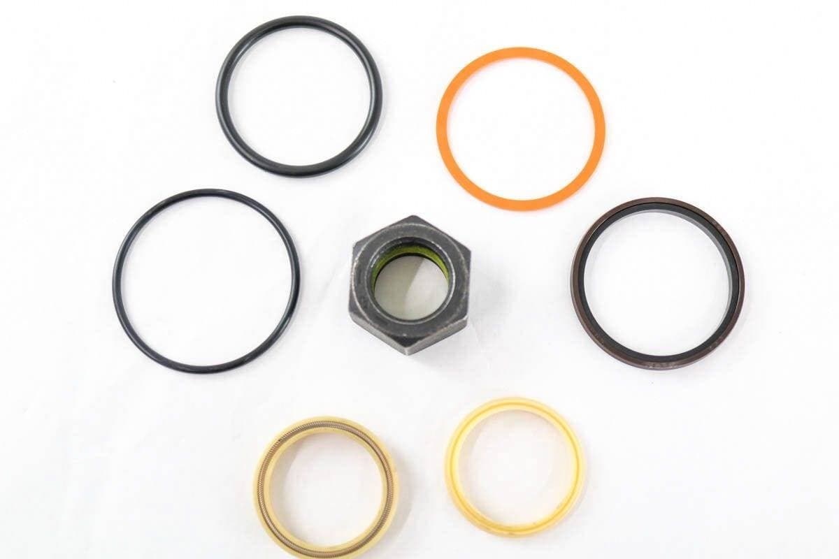 Genuine Bobcat Seal Kit 7168820 showing all seals and nut included in the kit.